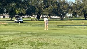 Golfer on putting practice green
